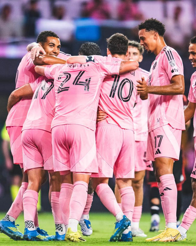 IMCF players celebrating in pink kits