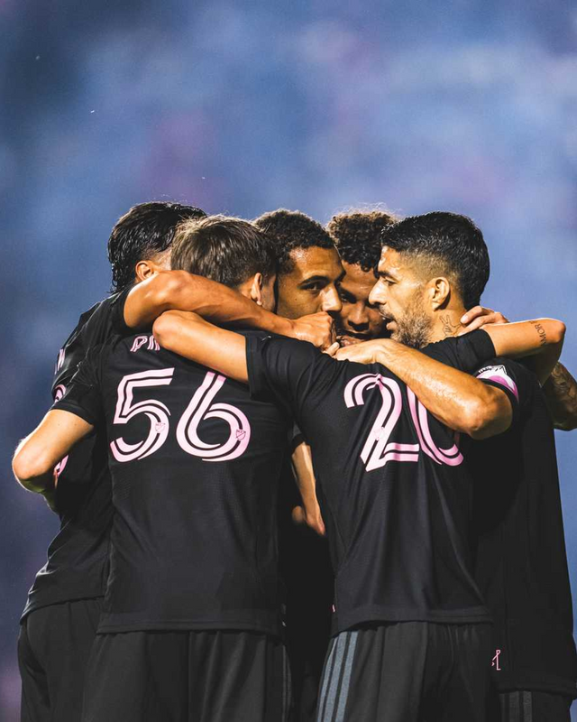 IMCF team huddle in black third kit