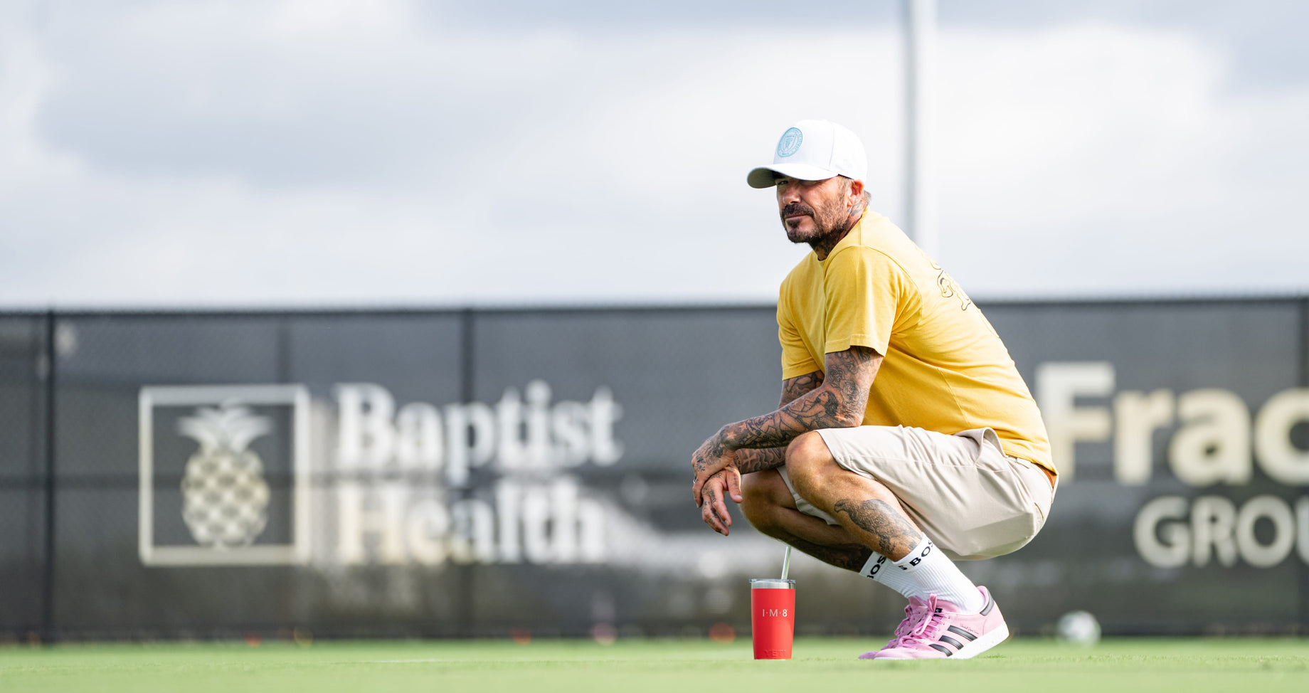 David Beckham crouching on Inter Miami CF training pitch